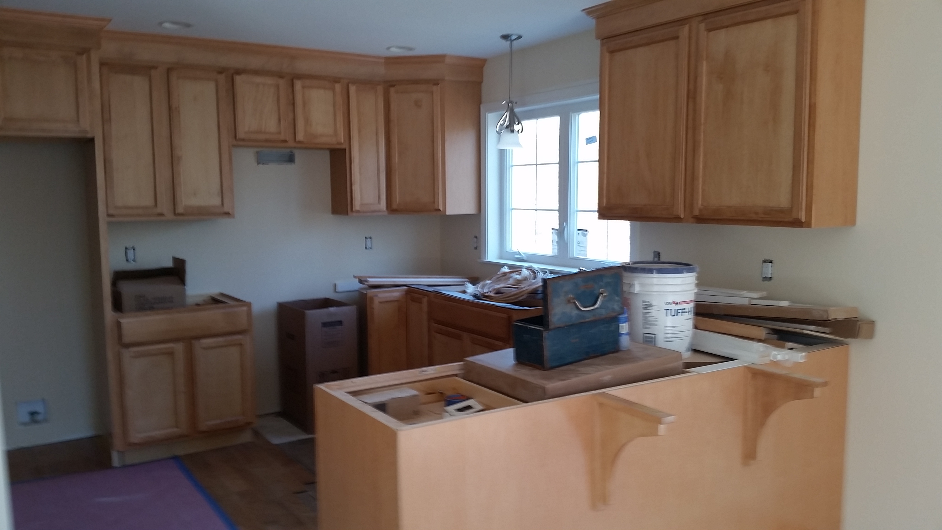 Kitchen Cabinets being installed