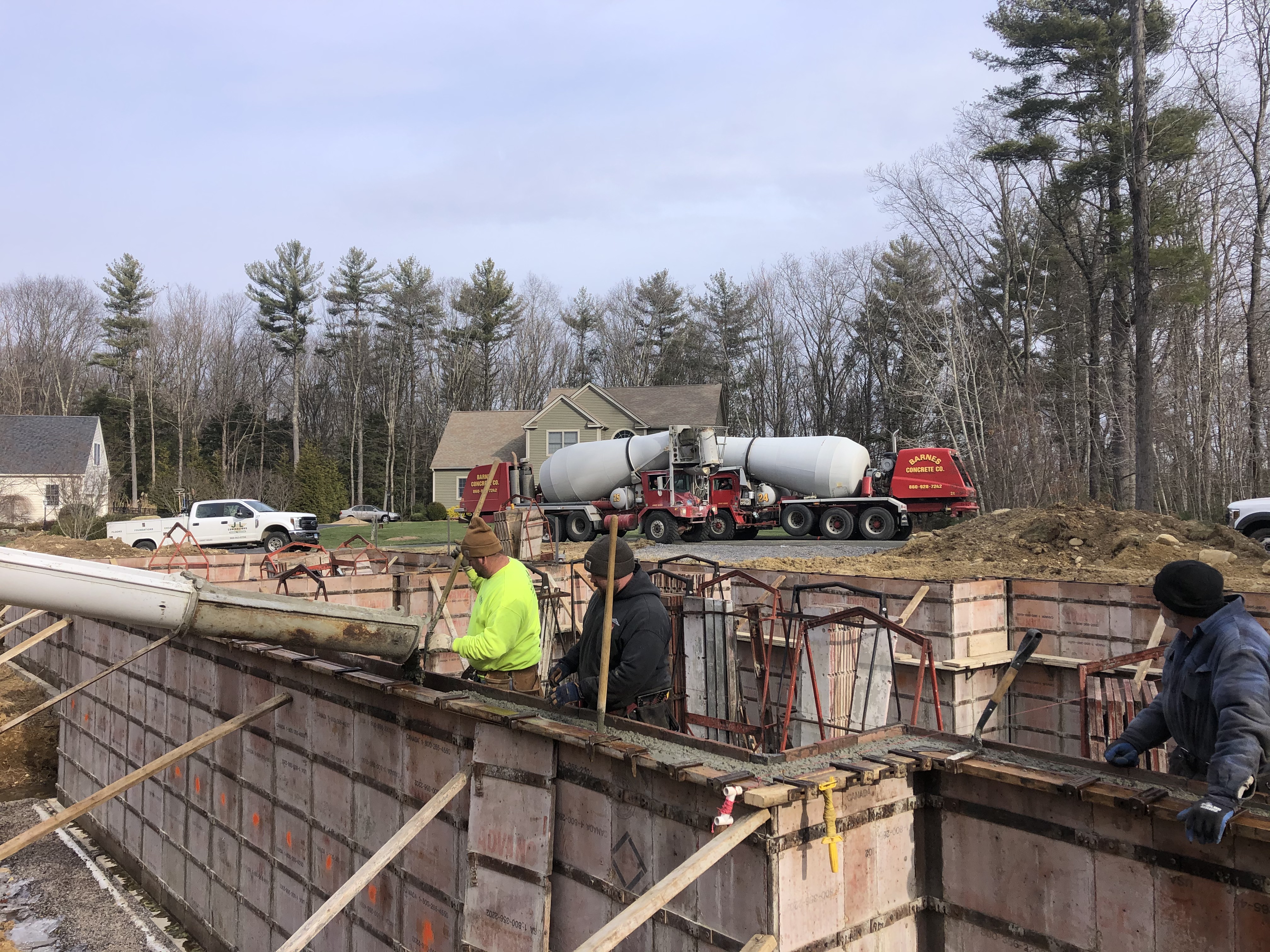 Pouring Cement into Foundation Forms