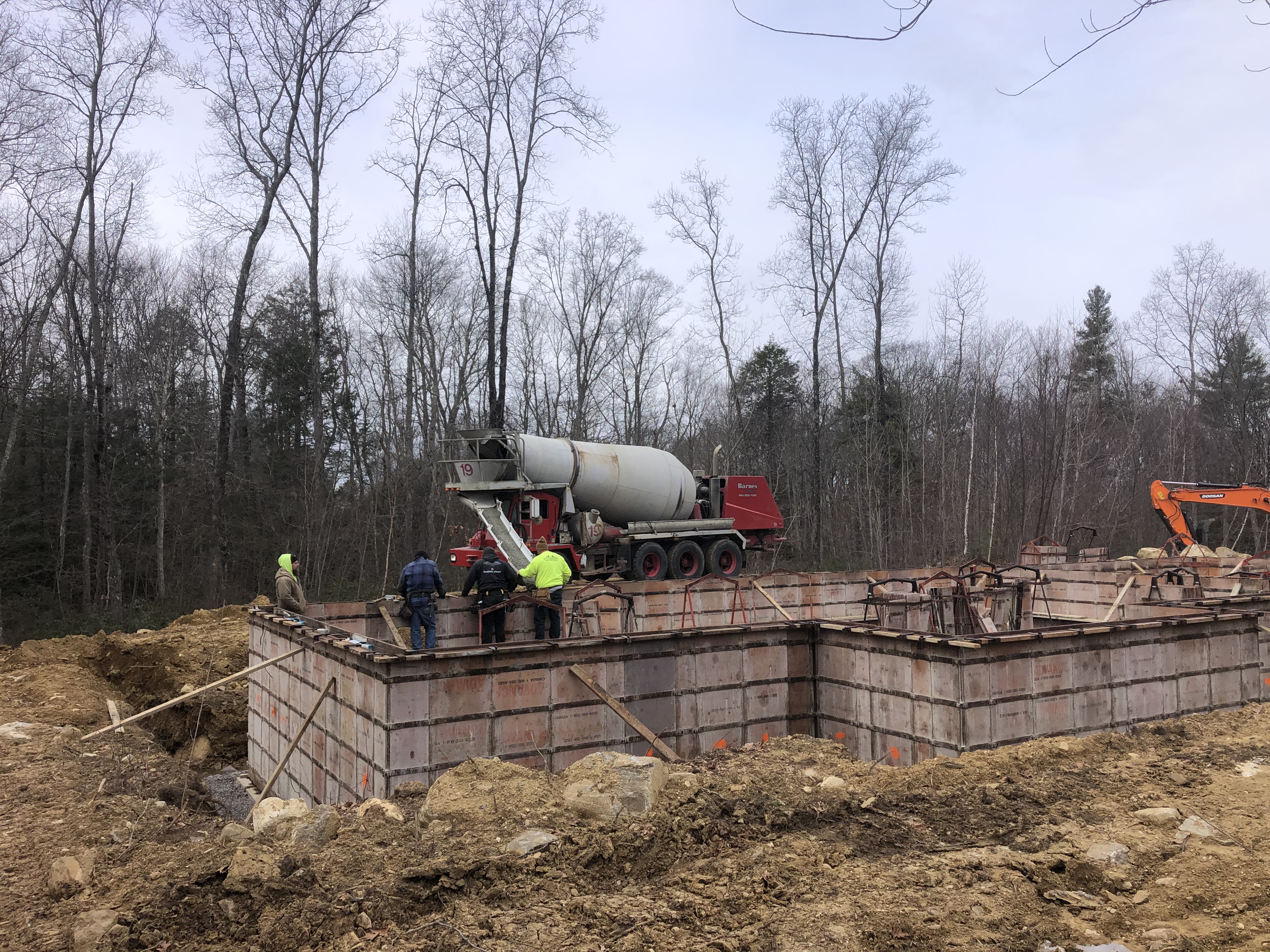 Pouring Cement into Foundation Forms