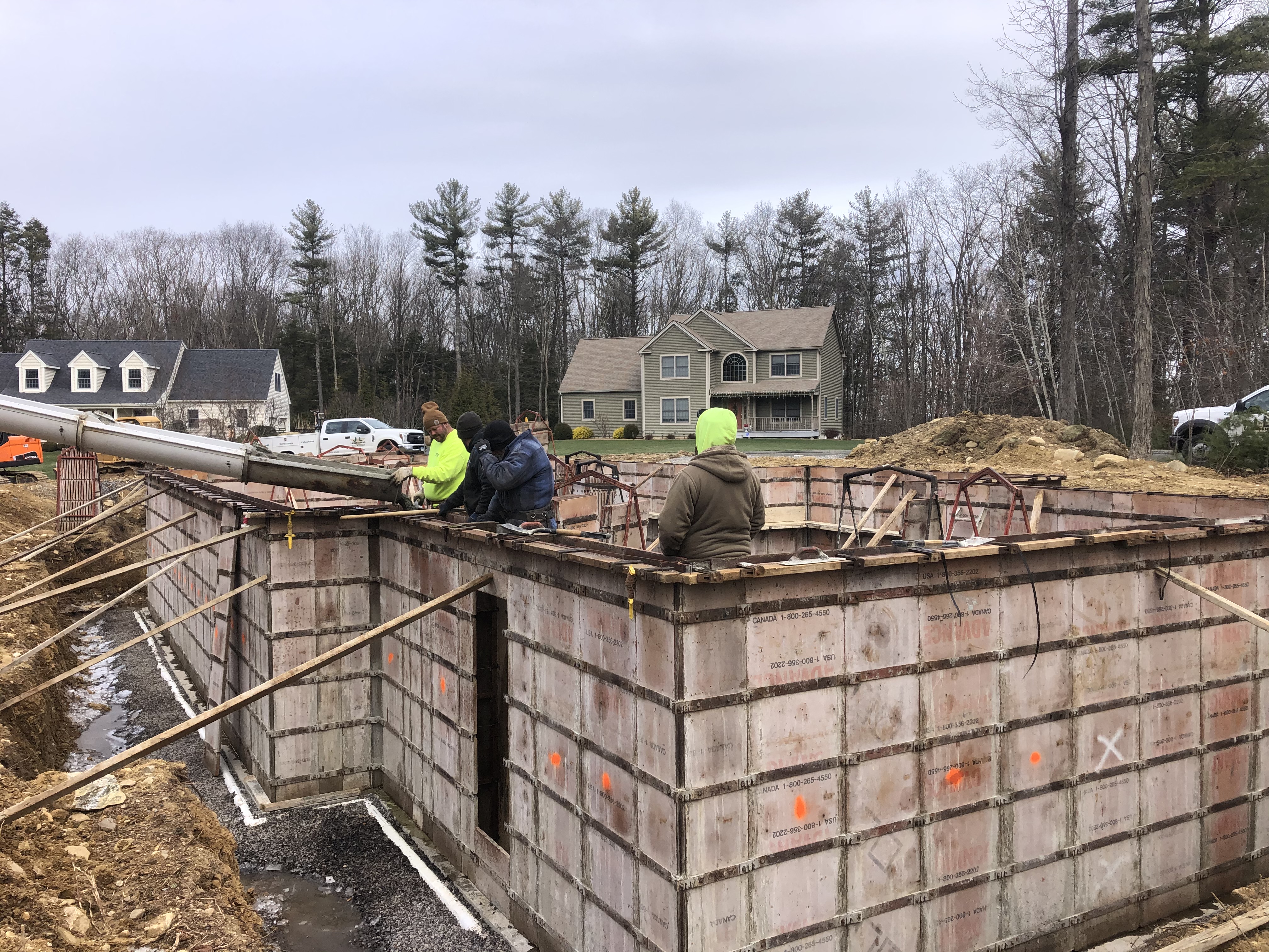 Pouring Cement into Foundation Forms